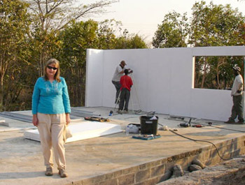 Carolyn Webster with workers on building site