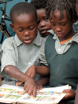 Children reading donated books